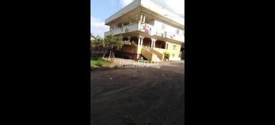 2 بيت وحديقه على 9 قيراط محاطين بسور ( كردون )